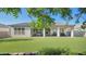 Spacious backyard featuring artificial turf and a covered patio, perfect for outdoor entertaining at 10643 E Tumbleweed Ave, Mesa, AZ 85212