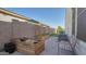 Landscaped backyard featuring raised garden beds, a seating area, and access to a putting green at 10643 E Tumbleweed Ave, Mesa, AZ 85212