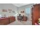 Cozy room with dark wood furniture, a gray chair, and a carpeted floor at 10643 E Tumbleweed Ave, Mesa, AZ 85212