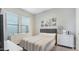 Cozy bedroom with a comfortable bed, dresser, and decor at 10643 E Tumbleweed Ave, Mesa, AZ 85212