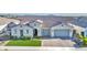 Aerial view of a single-Gathering home with a tile roof and paver driveway in a quiet neighborhood at 10643 E Tumbleweed Ave, Mesa, AZ 85212