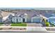 Aerial view of home with two-car garage, tile roof, and meticulous landscaping in suburban neighborhood at 10643 E Tumbleweed Ave, Mesa, AZ 85212