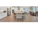 Bright and airy kitchen featuring a large island, stainless steel appliances, and ample cabinet space at 10643 E Tumbleweed Ave, Mesa, AZ 85212