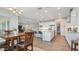 Spacious kitchen with white cabinets, a center island with seating, and stainless steel appliances at 10643 E Tumbleweed Ave, Mesa, AZ 85212