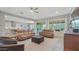 Open concept living space showcasing modern furnishings and seamless flow to kitchen and dining at 10643 E Tumbleweed Ave, Mesa, AZ 85212