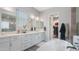 Bright bathroom features double vanities, walk-in closet access, and a soaking tub at 10643 E Tumbleweed Ave, Mesa, AZ 85212