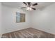 Bedroom with carpet, ceiling fan and window with closed blinds at 12132 W Caribbean Ln, El Mirage, AZ 85335