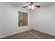Bedroom with carpet, ceiling fan and window with closed blinds at 12132 W Caribbean Ln, El Mirage, AZ 85335