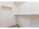 Walk-in closet with carpet and wooden shelving at 12132 W Caribbean Ln, El Mirage, AZ 85335