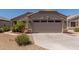 Charming beige single-story home with a spacious two-car garage and desert landscaping at 12132 W Caribbean Ln, El Mirage, AZ 85335
