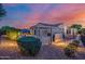 Backyard features a patio with outdoor kitchen, seating and nice landscaping at 13716 W Nogales Dr, Sun City West, AZ 85375