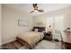 Bedroom with neutral walls, ceiling fan, and wood flooring at 13716 W Nogales Dr, Sun City West, AZ 85375