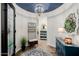 A beautifully decorated foyer with a round ceiling, stylish furnishings and decor at 13716 W Nogales Dr, Sun City West, AZ 85375