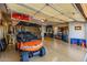 Spacious garage with epoxy floors offers plenty of room for parking and storage at 13716 W Nogales Dr, Sun City West, AZ 85375