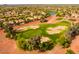 Expansive aerial view of the meticulously maintained community golf course surrounded by desert landscaping at 13716 W Nogales Dr, Sun City West, AZ 85375
