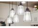 Close-up of stylish pendant lighting fixtures above a kitchen island, adding elegance at 13716 W Nogales Dr, Sun City West, AZ 85375