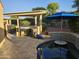 Inviting outdoor kitchen with stainless steel grill, perfect for alfresco dining and entertaining poolside at 13716 W Nogales Dr, Sun City West, AZ 85375