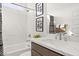 Modern bathroom with marble walls, sleek fixtures, and stylish design at 15348 W Gray Fox Trl, Surprise, AZ 85387