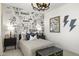 Modern bedroom with creative wall design, ambient lighting, and neutral tones for a calming retreat at 15348 W Gray Fox Trl, Surprise, AZ 85387