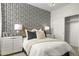 Charming bedroom featuring patterned wallpaper, soft textures, and a stylish closet at 15348 W Gray Fox Trl, Surprise, AZ 85387