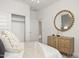 Bright bedroom featuring wood dresser, stylish accents, and closet at 15348 W Gray Fox Trl, Surprise, AZ 85387