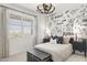 bedroom with creative wall design, cozy ambiance, and neutral tones for a playful yet calming atmosphere at 15348 W Gray Fox Trl, Surprise, AZ 85387