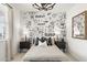 Charming bedroom featuring unique robot-themed wallpaper and stylish black and white decor at 15348 W Gray Fox Trl, Surprise, AZ 85387