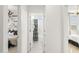 Bright hallway leading to the bedroom and bathroom, creating an inviting transition between spaces at 15348 W Gray Fox Trl, Surprise, AZ 85387