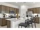 Well-appointed kitchen with a central island, modern appliances, and plenty of storage, perfect for cooking at 15348 W Gray Fox Trl, Surprise, AZ 85387