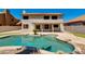 Beautiful pool area with rock features and lush greenery at 18207 N 46Th St, Phoenix, AZ 85032