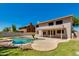 Lush backyard featuring a swimming pool and covered patio at 18207 N 46Th St, Phoenix, AZ 85032
