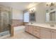 Bright bathroom with a tiled shower, a soaking tub and a double sink vanity at 18207 N 46Th St, Phoenix, AZ 85032