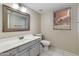 Well-lit bathroom features a single sink vanity, a window and tiled floors at 18207 N 46Th St, Phoenix, AZ 85032