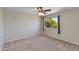 Bedroom with ceiling fan and natural light, offering carpet floors and a relaxing ambiance at 18207 N 46Th St, Phoenix, AZ 85032