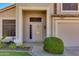 Inviting home entrance with a covered porch and well-maintained landscaping at 18207 N 46Th St, Phoenix, AZ 85032