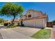Charming two-story home showcasing a spacious three-car garage and landscaped surroundings at 18207 N 46Th St, Phoenix, AZ 85032