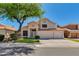 Charming two-story home featuring an attached three-car garage and landscaped surroundings at 18207 N 46Th St, Phoenix, AZ 85032