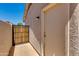 Side exterior view with gate access and storage, showing convenient outdoor features and secure access at 18207 N 46Th St, Phoenix, AZ 85032