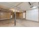 Garage featuring storage cabinets and a water heater at 18207 N 46Th St, Phoenix, AZ 85032