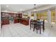 Spacious eat-in kitchen featuring dark wood cabinetry, stainless steel appliances, and bright natural light at 18207 N 46Th St, Phoenix, AZ 85032