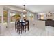 Bright breakfast nook with dark wood table with chairs, and natural light streaming in at 18207 N 46Th St, Phoenix, AZ 85032