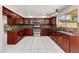 Bright kitchen featuring modern appliances, stylish countertops, and wooden cabinetry at 18207 N 46Th St, Phoenix, AZ 85032