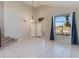 Bright living room with high ceilings, tile flooring and ample natural light at 18207 N 46Th St, Phoenix, AZ 85032