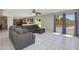 Spacious living room featuring tile flooring and an open layout leading to the backyard pool at 18207 N 46Th St, Phoenix, AZ 85032