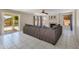 Cozy living area with a fireplace, ceiling fan, and sliding glass doors to the pool at 18207 N 46Th St, Phoenix, AZ 85032