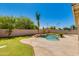 Inviting backyard pool surrounded by lush landscaping at 18207 N 46Th St, Phoenix, AZ 85032