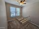 Bedroom features neutral walls, carpet flooring, and a window providing natural light and ventilation at 18871 S 209Th Way, Queen Creek, AZ 85142