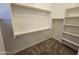 Well-organized walk-in closet with shelving and rods to maximize storage space at 18871 S 209Th Way, Queen Creek, AZ 85142