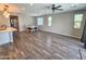 Spacious living area with wood floors, recessed lighting, and a dining table set for six at 18871 S 209Th Way, Queen Creek, AZ 85142