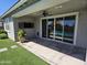 Covered patio with ceiling fan, pet door, and view of the pool, perfect for outdoor living at 18871 S 209Th Way, Queen Creek, AZ 85142